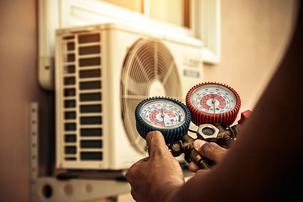 Professional Heat Pump Repair technician working in Topeka, KS